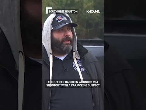 Video shows man pull wounded officer to safety after shootout on Southwest Freeway #shorts