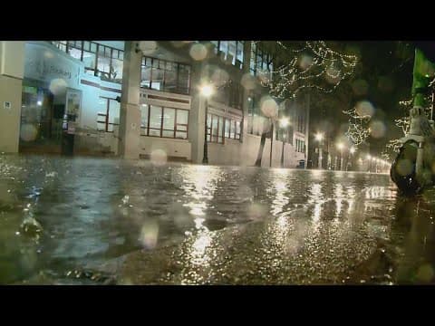 Crews in Old Town Alexandria clean up after Friday night's rain