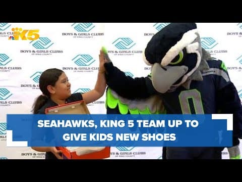 Seahawks' Blitz and KING 5's Madison Wade team up to give kids new shoes