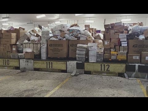 Photos show boxes of packages stacked up at Missouri City USPS Processing Center as delays continue
