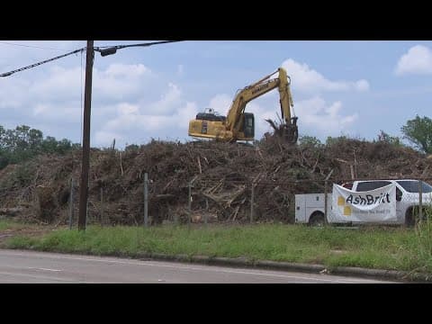 Nearly a month after the derecho storm, debris piles continue in the Houston area