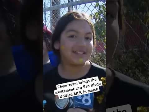 Cheer team brings the excitement at a San Diego Unified MLK Jr. march.