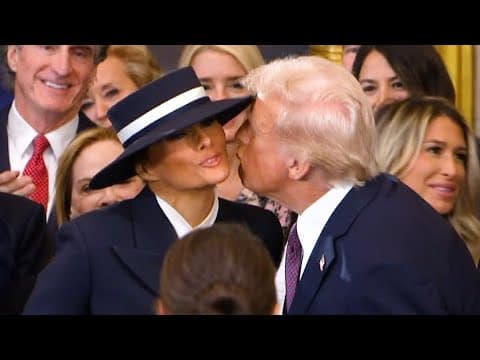 Donald Trump gives Melania Trump a kiss on the cheek as he enters for his presidential inauguration