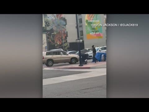 Caught on video: Driver attempts to run over bat-wielding man after altercation in Downtown San Dieg