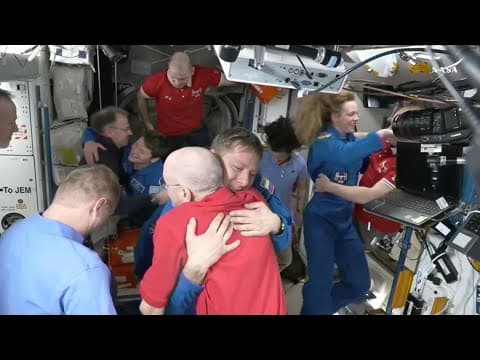 NASA's stuck astronauts welcome their newly arrived replacements to the space station