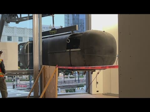Navy SEAL delivery vehicle hoisted through second-story window