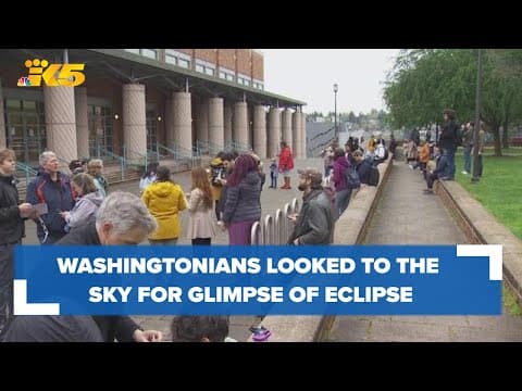 Despite cloudy weather, Washingtonians looked to the sky for the solar eclipse