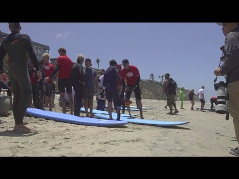Young shark attack survivor inspires thousands at Switchfoot Bro-Am beach fest