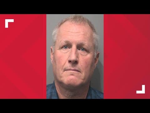 Johnson County coroner booked into jail on 14 charges