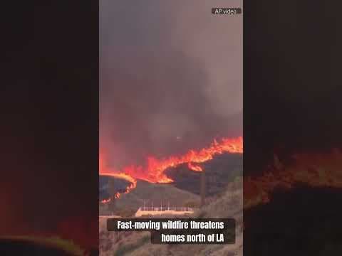 Fast-moving wildfire threatens homes north of LA, thousands ordered to evacuate