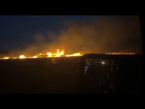 Highway 90 reopens, fire still burning
