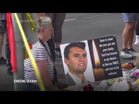 People mourn Charlie Kirk at a memorial set up at Utah Valley University