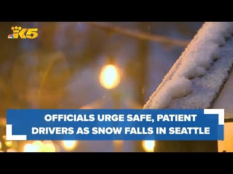 Officials urge drivers to be safe, patient as snow falls in Seattle