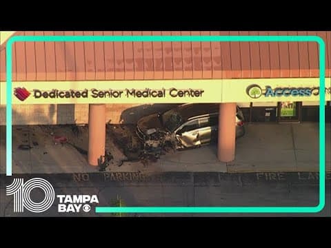 SUV crashes outside building in Kenneth City