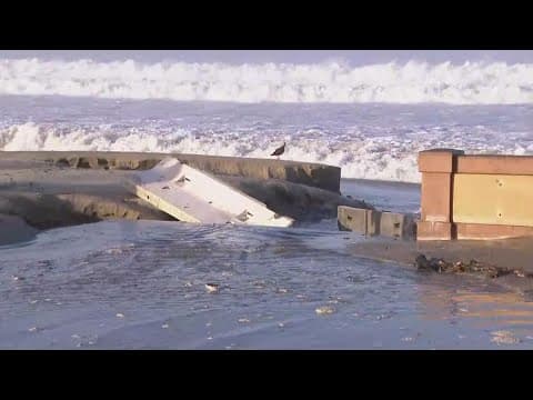 High surf floods Mission Beach boardwalk