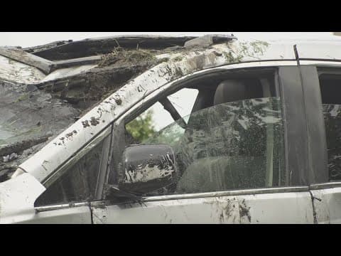Van crashes into canal during rainstorm