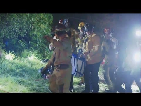 Firefighters speak on rescuing Indy, a retired police dog that was trapped in 60 foot hole