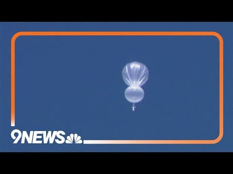 What is the white balloon flying north of Denver area?