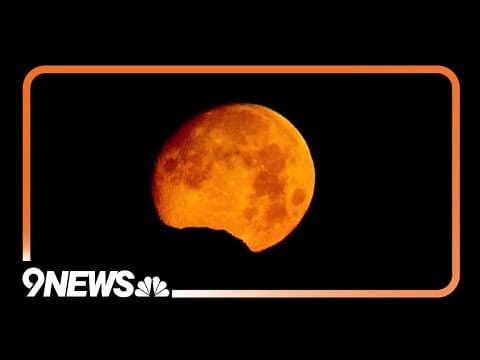 News helicopter captures moon dropping behind the Rocky Mountains