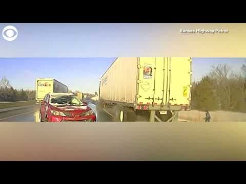 Highway patrol trooper narrowly avoids being hit by semi-truck