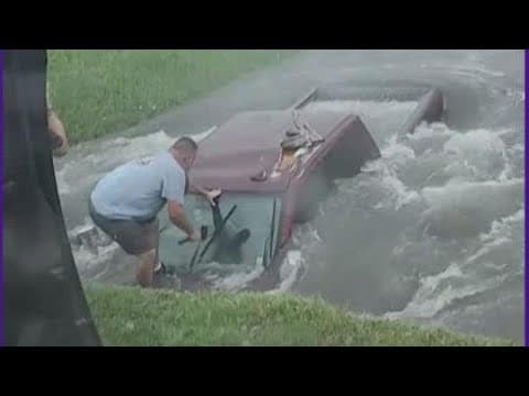 Texas man breaks window to rescue driver stuck in high water