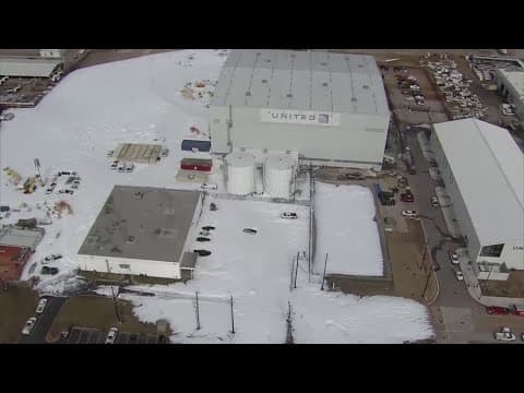 Foam covers hangar at Bush Airport after fire suppression system inadvertently goes off