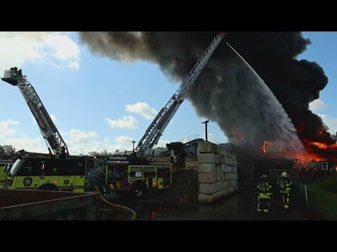 Crews remain on scene of scrapyard fire in Tampa that sent 2 firefighters to hospital