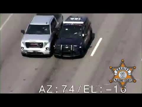 Michigan sheriff's deputy climbs into vehicle with dazed man who was driving erratically