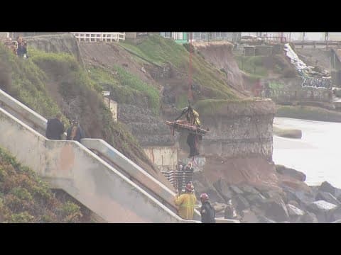 Video: Man rescued from small crevice along San Diego beach