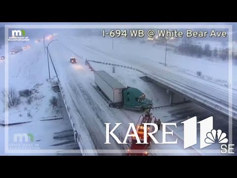 Semi hangs off overpass in east metro