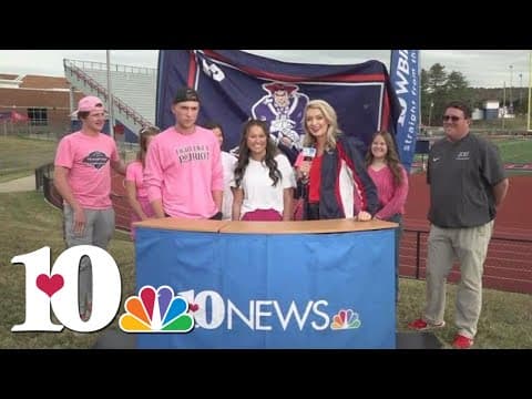 "The Riot" student section "Pinks out" for breast cancer awareness