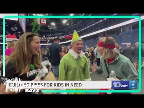 Volunteers from onbikes build more than 1,000 new bikes at Amalie Arena for kids in need