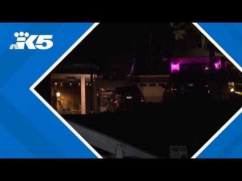 BREAKING: Car dangling off roof in West Seattle