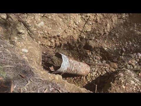 Ruptured stormwater pipe eroding hillside behind homes in Scripps Ranch