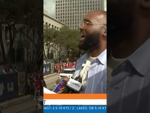 WWL’s Brandon Walker catches a bomb throw at Super Bowl LIX Parade