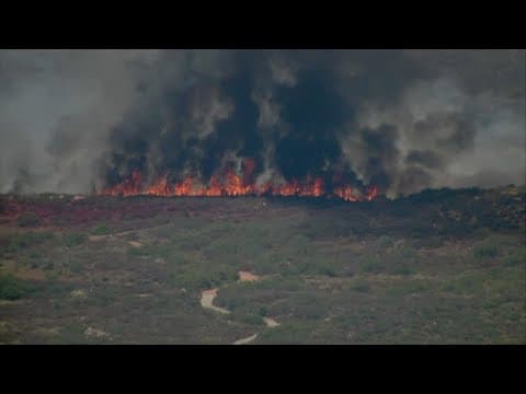 Cal Fire battles brush fire in Poway