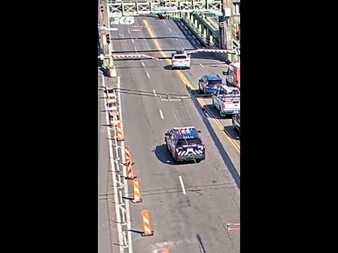 Driver fleeing police jumps partially-open University Bridge