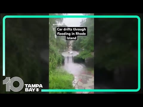 Car drifts through flooding in Rhode Island