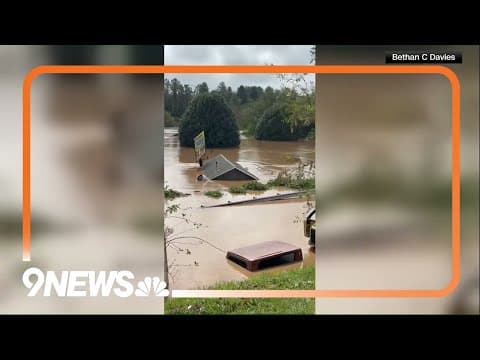 Roof floats by in extreme flooding in Asheville, North Carolina