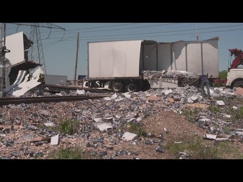 Train slams into semi truck, spilling beer across the roadway in North Texas