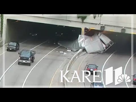 RAW VIDEO: Truck carrying ammunition splits apart in crash at Lowry Tunnel