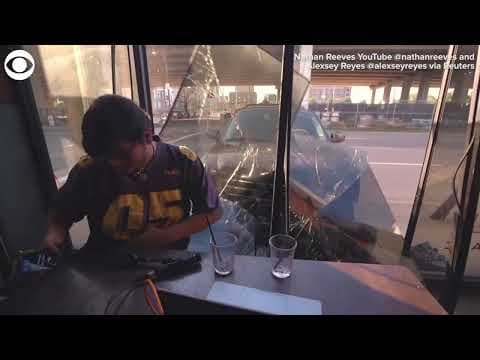 Car crashes into window during live podcast broadcast