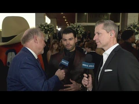 Emcee Lance McCullers drops in on Jason Bristoland Matt Musil during the live shot