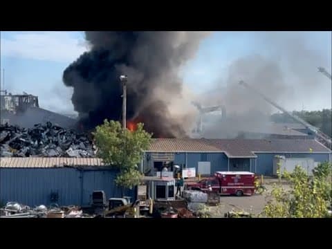 VIDEO: Fire burns at Dallas recycling facility, produces large plume of black smoke