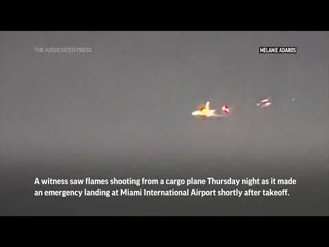 Flames seen shooting from cargo plane before emergency landing