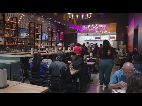 People wait outside Shaq's Big Chicken for several days to try and win free food