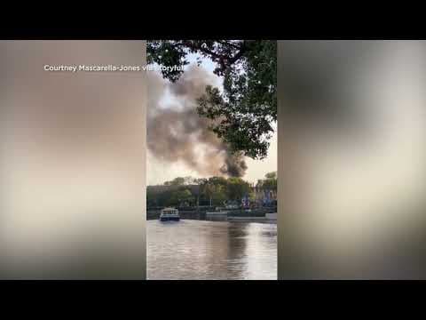 Smoke plume rises above France Pavilion at Disney World's Epcot park
