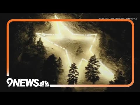 Boulder Star, symbol of hope, lit early to spread unity