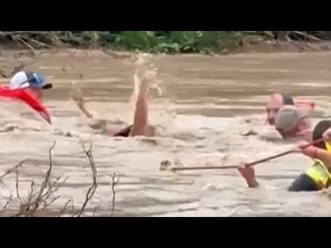 Video shows firefighters rescue driver trapped in floodwaters in Wall, Texas