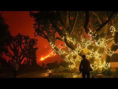 Homes burn as wind-driven wildfire prompts evacuations in Malibu, California